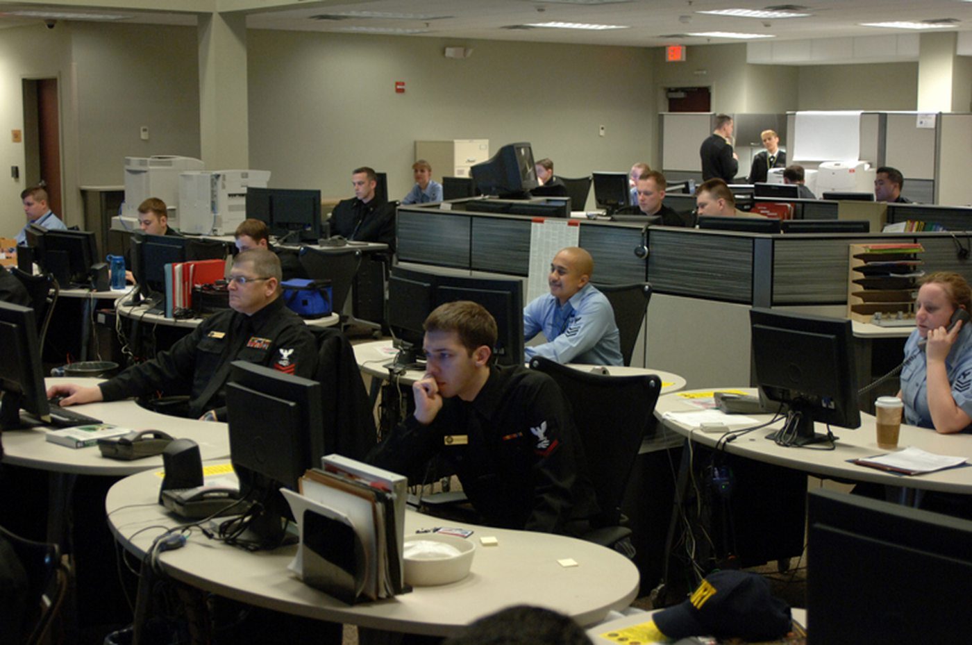 Operations floor with analysts at workstations. Not a photograph of this incident.