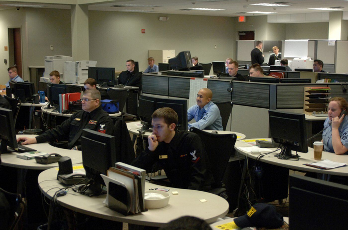 Operations floor with analysts at workstations. Not a photograph of this incident.